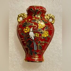 Elegant Red and Gold Vase with Floral Design